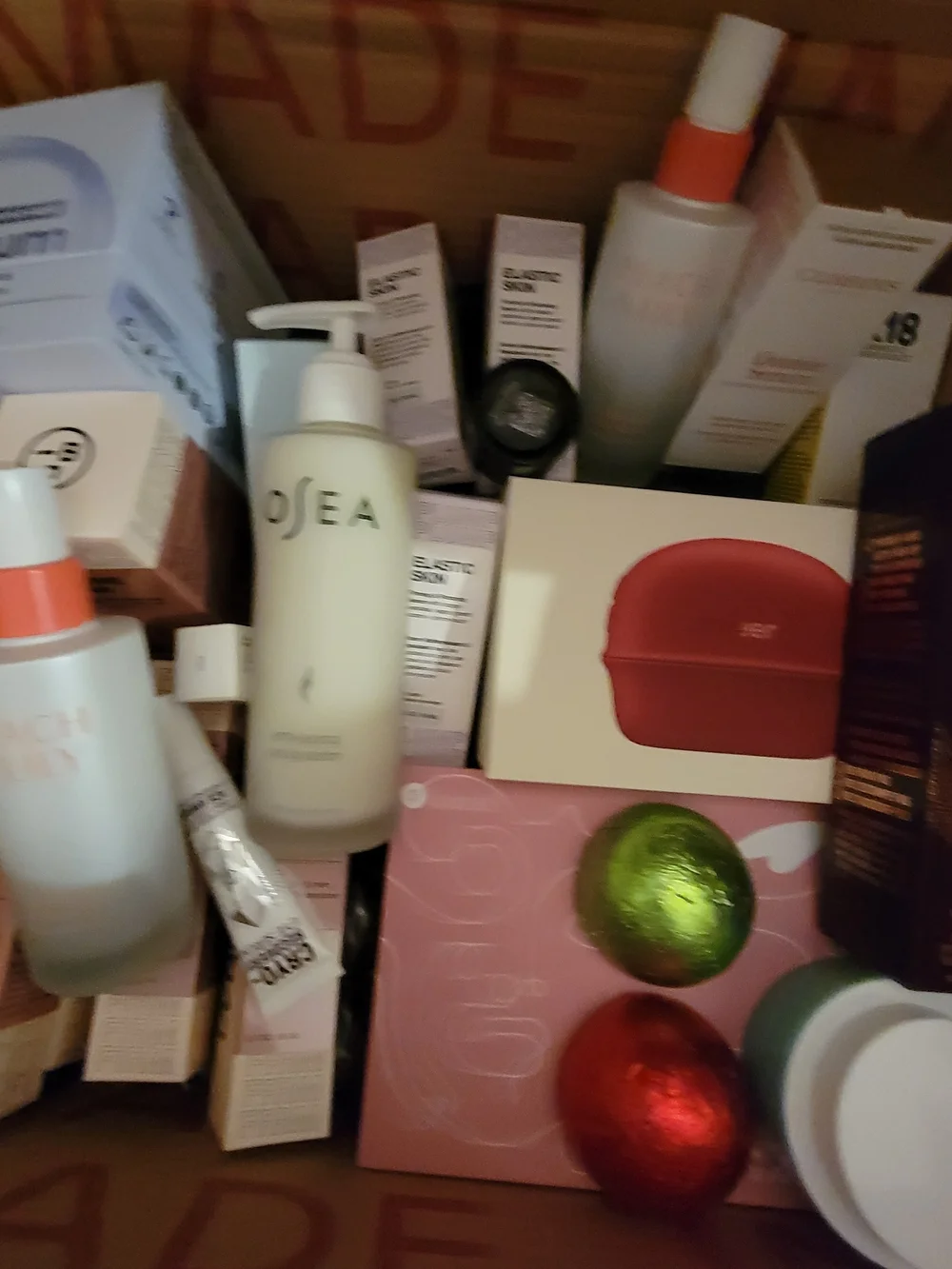 A Box Full Of Many High End Facial Items & Women's 8 Piece White Makeup Brushes